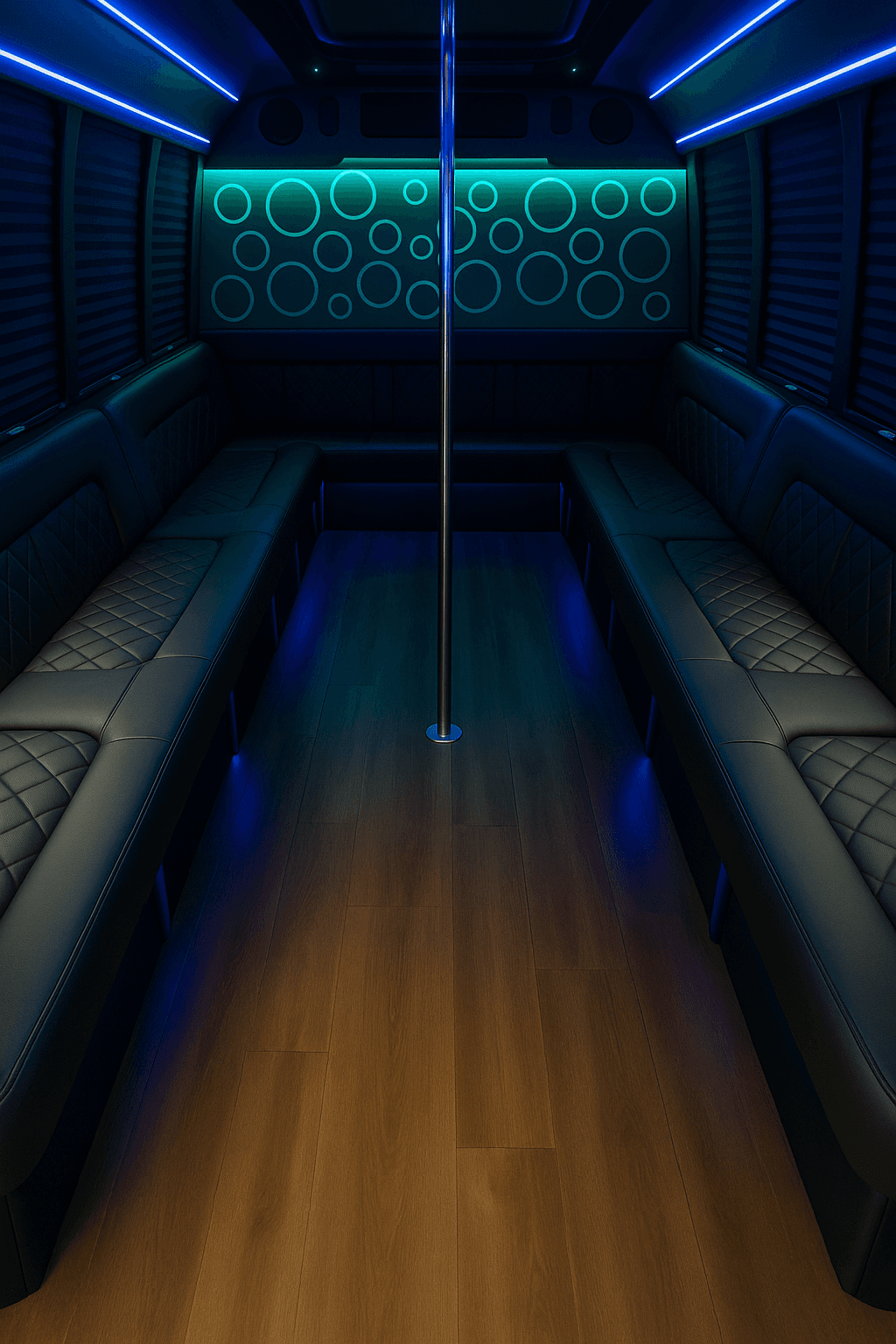 Inside a 20 passenger party bus with bench seating and a lit bar area